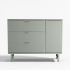 a grey dresser with gold handles and drawers