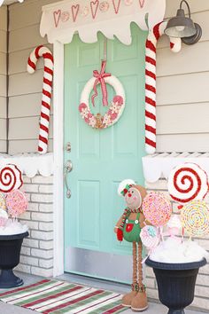 a front door decorated for christmas with candy canes