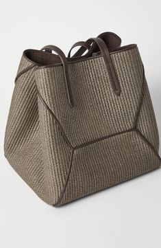 The material is characterized by a slightly “rustic” woven texture inspired by the typical appearance of raffia. Magnetic snap closure Double handle Cotton lining Internal pocket with zip closure Nickel-free monili decoration Bag is 20.87" long, 8.66" wide and 11.42" high Raffia Bag, Woman Bags Handbags, Woven Texture, Bag Light, Eyewear Womens, Boutique Online, Best Bags, Shopper Tote, Blazers For Men