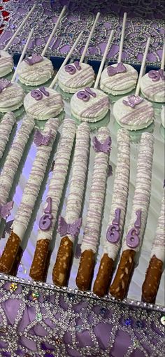 there are many desserts on the table ready to be cut and served for guests