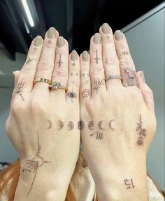 two women with tattoos on their hands