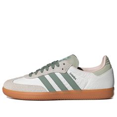 The adidas Samba OG Silver Green Putty Mauve is a classic sneaker inspired by the original 1950s indoor soccer shoe. Featuring a white leather upper with hairy suede detailing in beige, the shoe boasts iconic green stripes and a green heel tab. The rubber outsole provides traction, and the shoe is made with at least 20% recycled materials. Samba Shoes, Adidas Samba Og, Limited Edition Sneakers, Green Heels, Green Sneakers, Green Brands, Classic Sneakers, Adidas Samba, White Silver