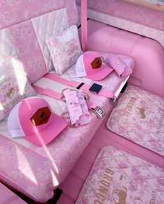 the inside of a pink and white car with matching accessories on it's seats