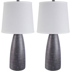 two gray lamps with white shades on them