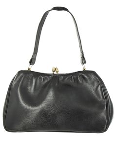 A vintage 1950s black faux grain leather bag.  Lined in black fabric with a main compartment and small envelope pocket,  This bag has great period style to authenticate your vintage ensemble.  The fittings are a mixture of gold and silver to make it versatile and the top handle is long enough to use as a shoulder strap and tuck neatly under your arm.  There are some age-related marks to the interior. The bag is 26 cm width x 16.5 cm height x 6 cm depth excluding the handles. Small Envelope, Envelope Pocket, Vintage Style Shoes, Gloves Vintage, Vintage Knitwear, Vintage Gloves, Retro Glasses, Vintage Trousers, Faux Leather Bag