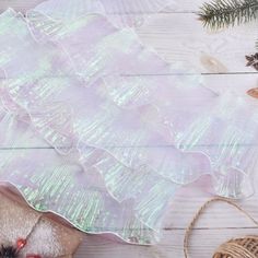 a table topped with lots of different types of christmas decorations and ornaments on top of it