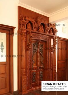 an ornate wooden door in the corner of a room