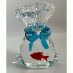 a glass vase with two fish in it