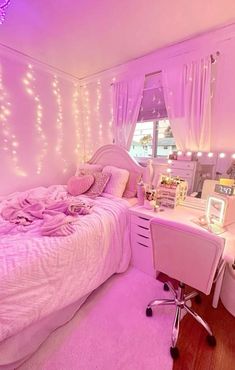 a bedroom with pink lights and a bed in the corner, along with a desk