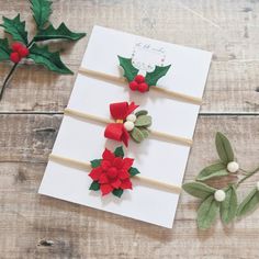 A gorgeous set of three Christmas baby headbands featuring holly, a poinsettia and mistletoe on soft nylon headbands. Will fit newborn up to adult. Ideal Christmas set or gift set as they will match any festive outfit! Can also be purchased separately.  🌸 SIZE: Measures approx 6cm across. Measurements may vary slightly due to being handmade.  🌸 SAFETY NOTICE: Please note that these accessories are intended for use under adult supervision. Never allow your baby to sleep in a headband. 🌸 PROCES Christmas Headband Baby, Headband Christmas, Girl Headbands, Felt Flower Headband, Red Poinsettia, Bow Christmas, Christmas Headband, Holly Leaves, Christmas Poinsettia