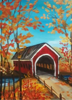 an image of a red covered bridge in the fall with trees and leaves on it