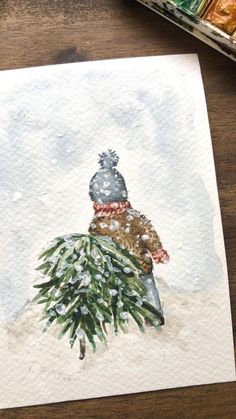 a watercolor painting of a christmas tree with a hat on it's head