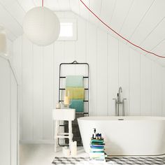 a white bath tub sitting inside of a bathroom