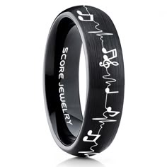 a black ring with white writing on the inside and an image of heartbeats in it