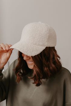 Our Solid Cream Sherpa Baseball Cap is the perfect finishing touch to any casual look! With a velcro back, you can easily do a ponytail or a simple bun. If you're on the go, just style it with your favorite lounge wear for an everyday chic outfit. Soft Sherpa material Velcro back Machine wash Color: Cream Colors may vary on different viewing devices Size and Fit One size fits most Adjustable Super Soft Cap, Casual Super Soft Cap, Soft Comfortable Hats, One Size Fits Most, Cozy Adjustable Super Soft Hats, Soft Cap One Size Fits Most, Casual Soft Cap, White Super Soft Hat, One Size Fits Most, Trendy Winter Hat With Curved Visor, White Super Soft Hat One Size Fits Most