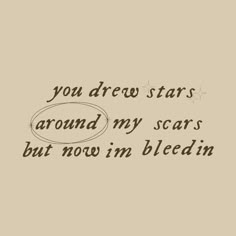 the words are written in black ink on a beige background, with stars above it