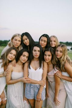 a group of young women standing next to each other