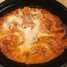 a close up of a pizza in a crock pot