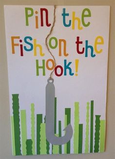 a sign that says pin the fish on the hook