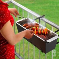 a woman is grilling food on an outdoor grill with the words grill for a balcony