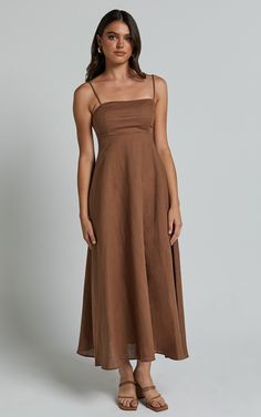 Elevate your summer wardrobe with the Brette Midi Dress in Tobacco. This stunning linen look dress features a flattering sweetheart neckline and stylish strappy details, making it perfect for both casual occasions and special events. The fit and flare silhouette accentuates your curves while providing a comfortable and breezy feel. Made from high-quality linen fabric, this sleeveless dress is ideal for staying cool on those hot days. Whether you're heading to brunch or a beach party, the Brette Fit And Flare Silhouette, Dress Linen, Linen Dresses, Hot Days, Fit And Flare Dress, Beach Party, Summer Wardrobe, Flare Dress, Sweetheart Neckline