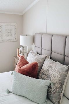 Gray upholstered headboard with throw pillows and white comforter Gray Upholstered Bed, Headboard Design, Beds And Headboards, Headboard Designs, Upholstered Bed, Aesthetic Bedroom, Wooden Furniture, Upholstered Beds, Queen Size Bedding