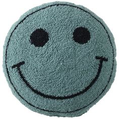 a blue smiley face rug on a white background