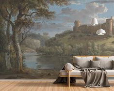 a living room with a painting on the wall and a couch in front of it