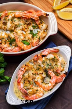 two white dishes filled with shrimp and cheese