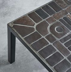 a coffee table made out of different colored bricks