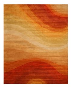 an orange, yellow and red rug with wavy lines on the bottom half of it