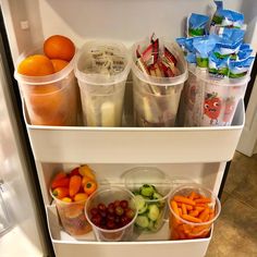 a refrigerator filled with lots of different types of fruits and veggies in plastic containers