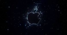 an apple logo made out of stars in the night sky with no one around it