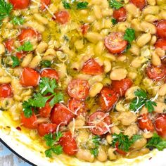 a large pot filled with beans and tomatoes