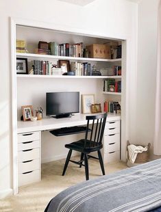 a bedroom with a bed, desk and bookshelf