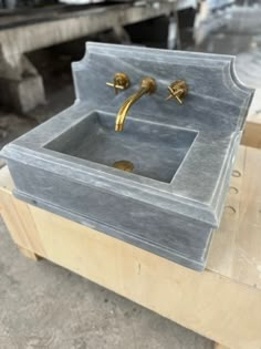 a sink that is sitting on some wood