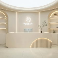 a white reception area with circular lighting