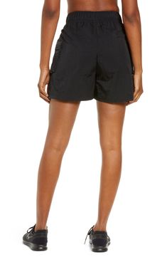 These high-waisted shorts are made from a soft, smooth woven fabric with a roomy fit, making them perfect for workouts and casual wear. Cargo pockets allow for secure storage of your small essentials. 4 1/2" inseam; 28" leg opening; 13" front rise; 17" back rise (size Medium) Drawcord-toggle waist 100% nylon Machine wash, tumble dry Imported