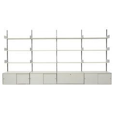 a white shelf with four drawers and three shelves on each side, in front of a white background