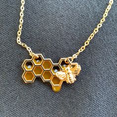 Dripping Honeycomb Necklace Is Eco Friendly With Antique Gold Finish. Yellow Resin. Cable Chain Brass. 20”+2” Extension Dripping Honeycomb, Resin Shakers, Yellow Resin, Honeycomb Necklace, Gold Yellow, Cable Chain, Honeycomb, Gold Finish, Antique Gold