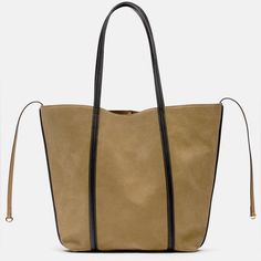 Zara Suede Tote Bag In Taupe Brown Brand New With Tags. Msrp $149.00. No Low Offers Please. Suede Tote Bag. Side Tie Detail. Lined Interior. Shoulder Straps. Magnetic Closure. Approximate Height X Length X Width: 17.2 X 14 X 4.3 Inches (43.8 X 35.5 X 11 Cm) Outer Shell Main Material 100% Cow Leather Additional Material 100% Polyurethane Lining 100% Polyester Taupe Brown | 6059/110 New Posher? Sign Up With Invite Code 0ld_fashioned For $10 Off Your First Poshmark Purchase My Photos Are Taken Insi Chic Suede Hobo Bag For Shopping, Chic Khaki Bag With Double Handle, Chic Khaki Bag With Adjustable Strap, Chic Khaki Double Handle Bag, Chic Khaki Bag For Shopping, Chic Khaki Shopping Bag, Chic Khaki Bucket Bag With Large Capacity, Chic Suede Shopping Bag, Chic Light Brown Bag For Errands