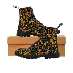 Feminine combat boots with a floral design over a black background.  Floral design features earth tones in yellow, blue, green and red.  Very cute utility boots that can easily be dressed up or down. Painted Combat Boots, Eclectic Shoes, Multicolor Floral Embroidery Boots With Round Toe, Military Boots With Flowers, Boho Chic Boots, Utility Boots, Women's Combat Boots, Multicolor Floral Embroidered Round Toe Boots, Floral Combat Boots