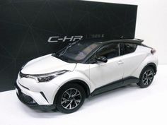 a white toyota c - hr is shown in front of a black box with the word chr on it