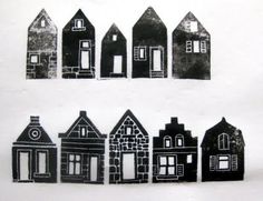 black and white drawing of small houses in different shapes, sizes and colors on paper