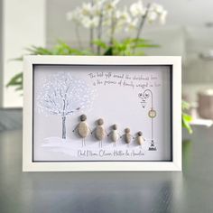 three little birds are standing in front of a white frame with the words, love and family written on it