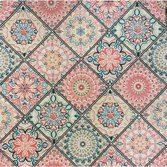 an intricately designed rug with many different colors and designs on the surface, including flowers