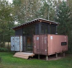 a small house made out of shipping containers