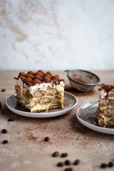 two pieces of cake sitting on top of plates next to each other with chocolate chips