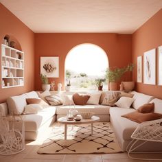 a living room filled with lots of white furniture and orange wall paint on the walls