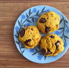 three chocolate chip cookies on a blue plate